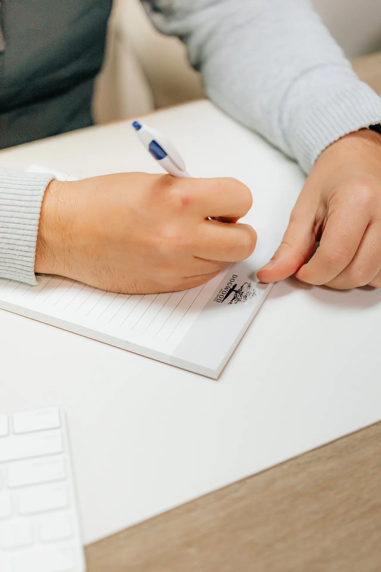 A property manager taking maintenance notes